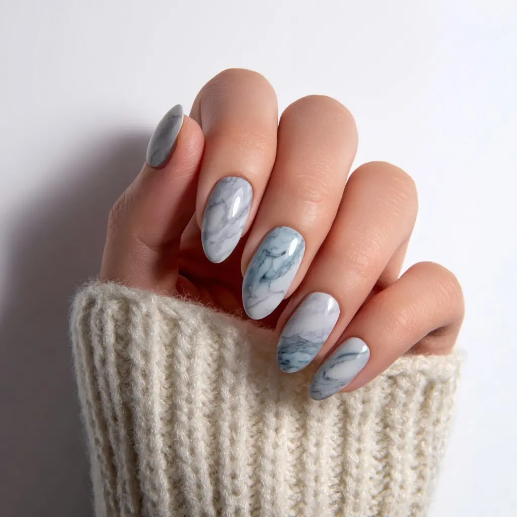 blue and white almond medium nails with abstract and matte