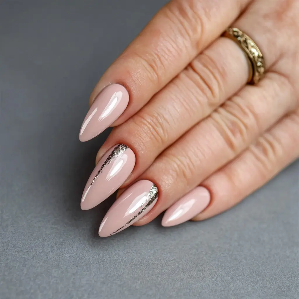 nude and metallic stiletto long nails with glitter and glossy