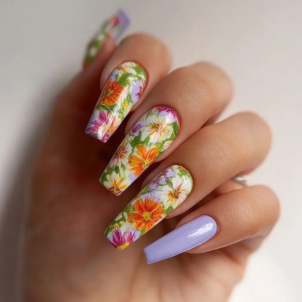 yellow and orange coffin long nails with floral and abstract