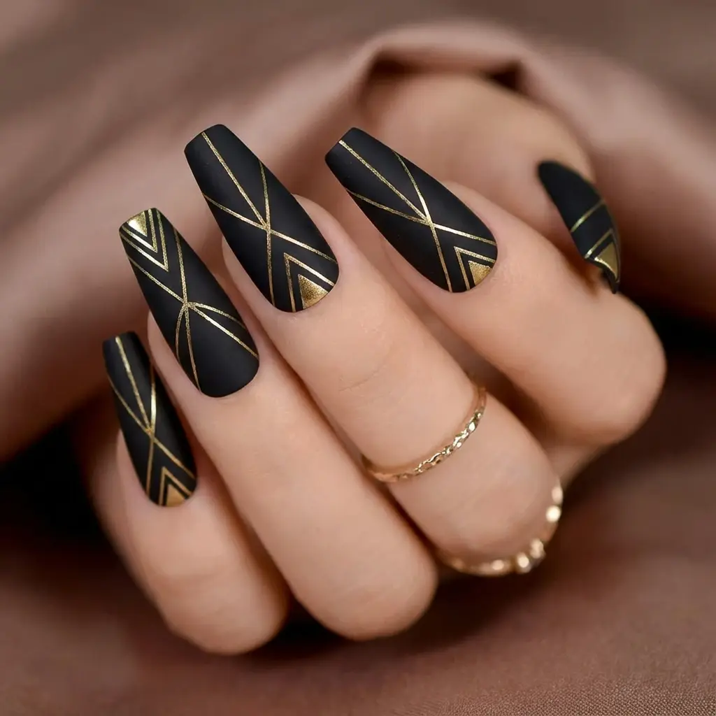 black and metallic coffin long nails with geometric and modern